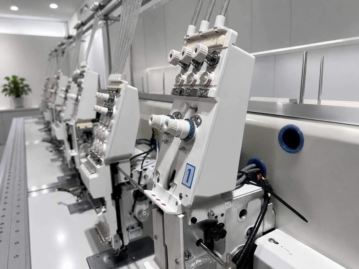 Technical embroidery production machine configured for textile capability deployment